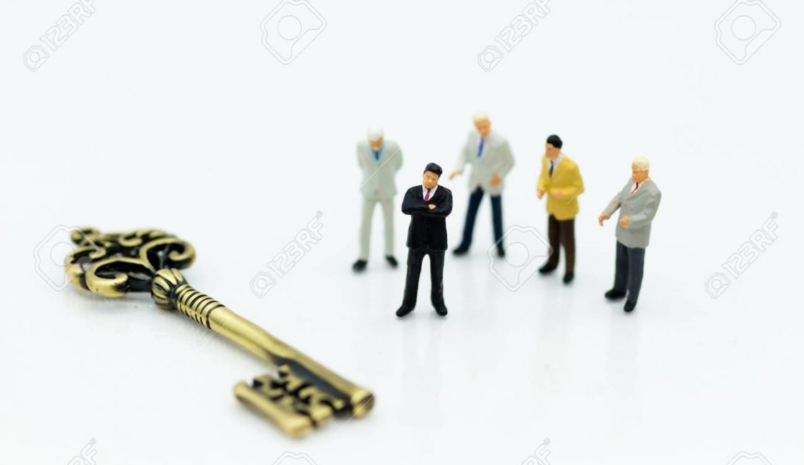 Miniature people: Group Businessmen stand with master key. Image use for key man, the key to success, business concept.